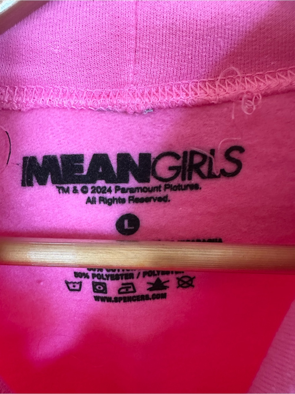 Spencer's Mean Girls “On Wednesdays We Wear Pink” Pink Graphic Hoodie - Picture 5 of 7